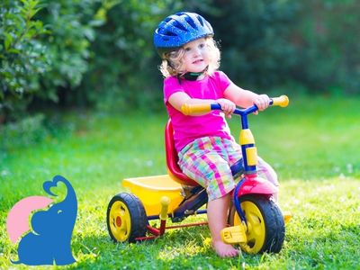 Kinder fahren Dreirad